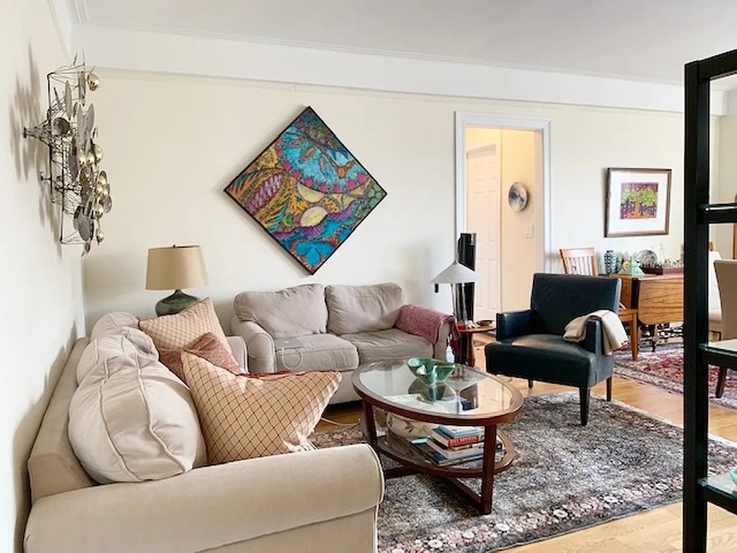 a living room with furniture and a rug