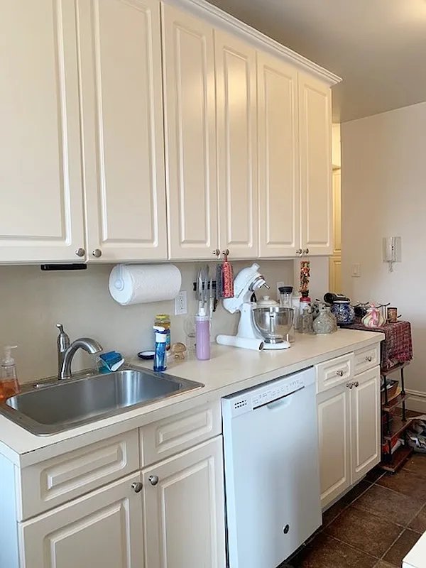 425 Riverside Drive, Unit 6J Manhattan, NY 10025 - Photo 5 of 17 a kitchen with stainless steel appliances granite countertop a sink a stove and cabinets