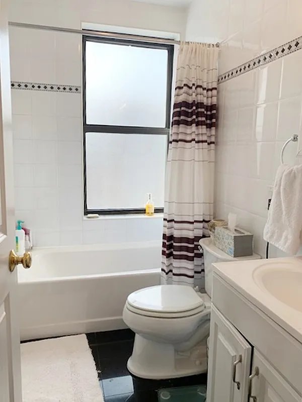 425 Riverside Drive, Unit 6J Manhattan, NY 10025 - Photo 7 of 17 a bathroom with a sink toilet and mirror