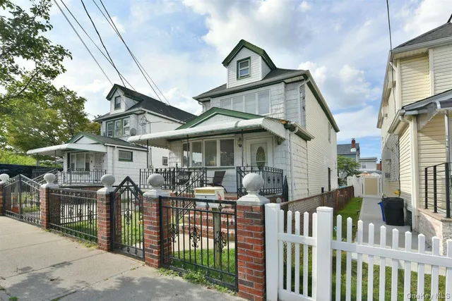 a front view of house yard and balcony