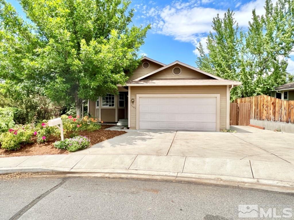 3365 Lookout Place Reno, NV 89503 - Photo 1 of 39 a front view of a house with a yard and garage