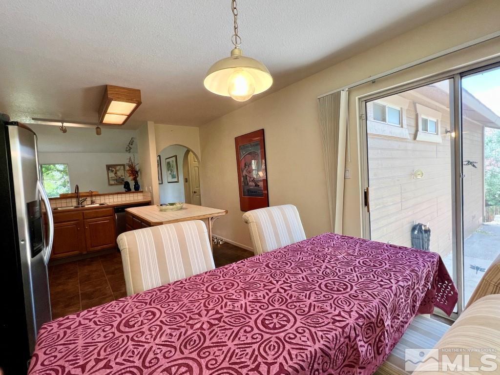 3365 Lookout Place Reno, NV 89503 - Photo 11 of 39 a bedroom with a bed and a chandelier