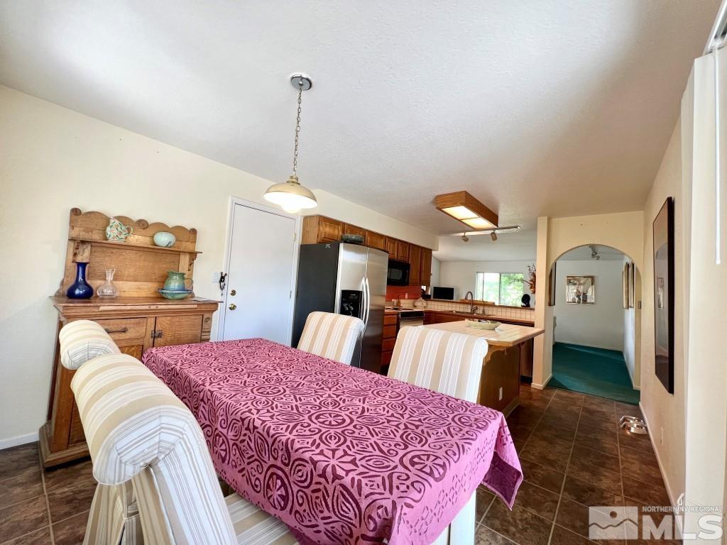3365 Lookout Place Reno, NV 89503 - Photo 12 of 39 a spacious bedroom with a bed and a view of kitchen