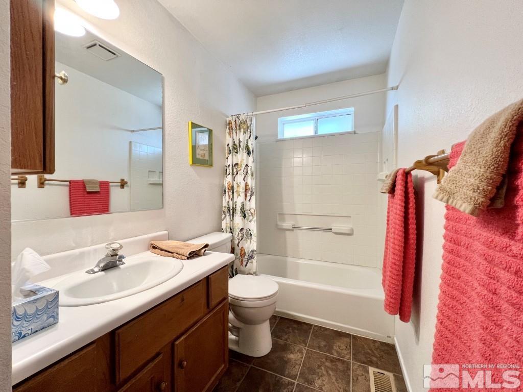 3365 Lookout Place Reno, NV 89503 - Photo 14 of 39 a bathroom with a sink a toilet and shower