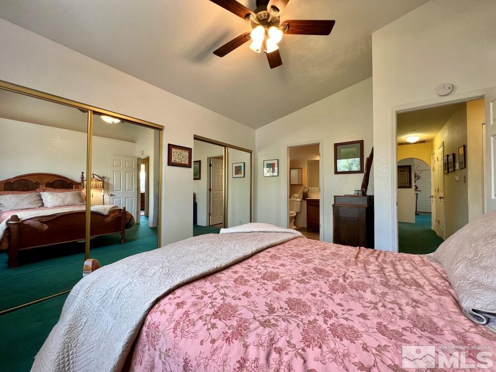 3365 Lookout Place Reno, NV 89503 - Photo 19 of 39 a bedroom with a large bed and ceiling fan