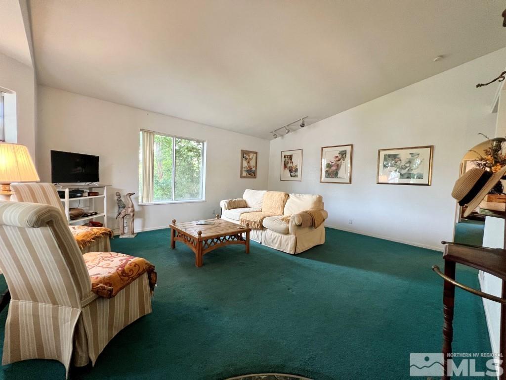 3365 Lookout Place Reno, NV 89503 - Photo 2 of 39 a living room with furniture a flat screen tv and a window