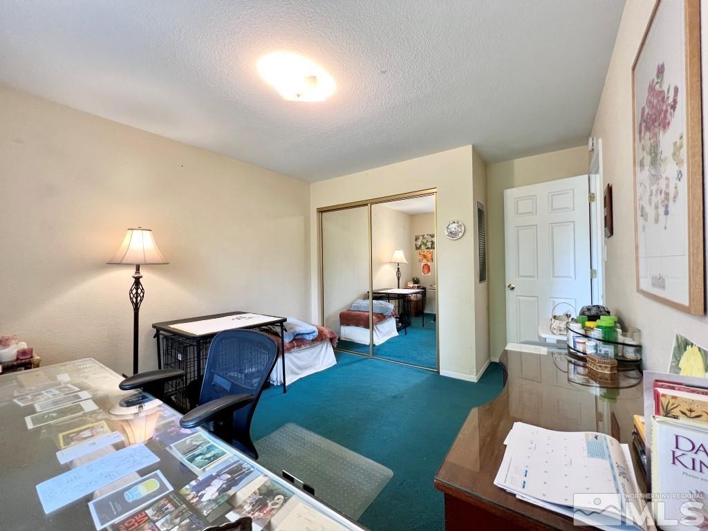 3365 Lookout Place Reno, NV 89503 - Photo 25 of 39 a living room with furniture and a lamp