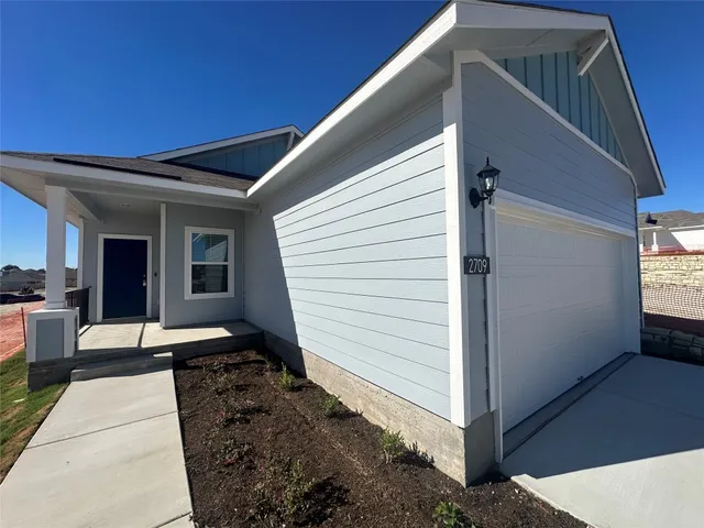a view of a porch with seating space