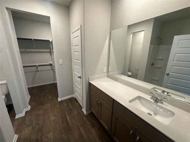 a bathroom with a double vanity sink and mirror
