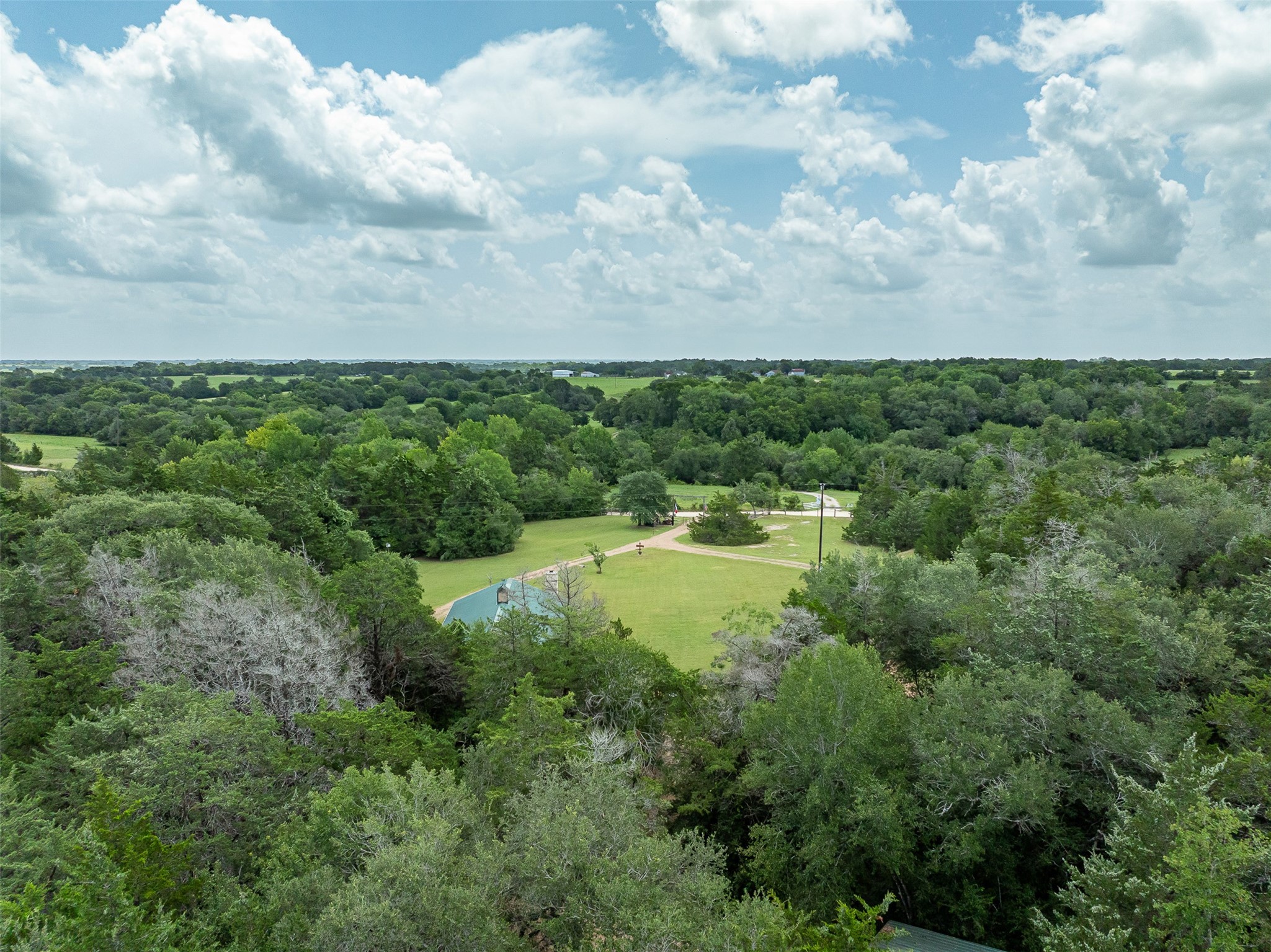 10900 Mayer Cemetery Road Burton, TX 77835 - Photo 2 of 24 a view of a garden and basketball court