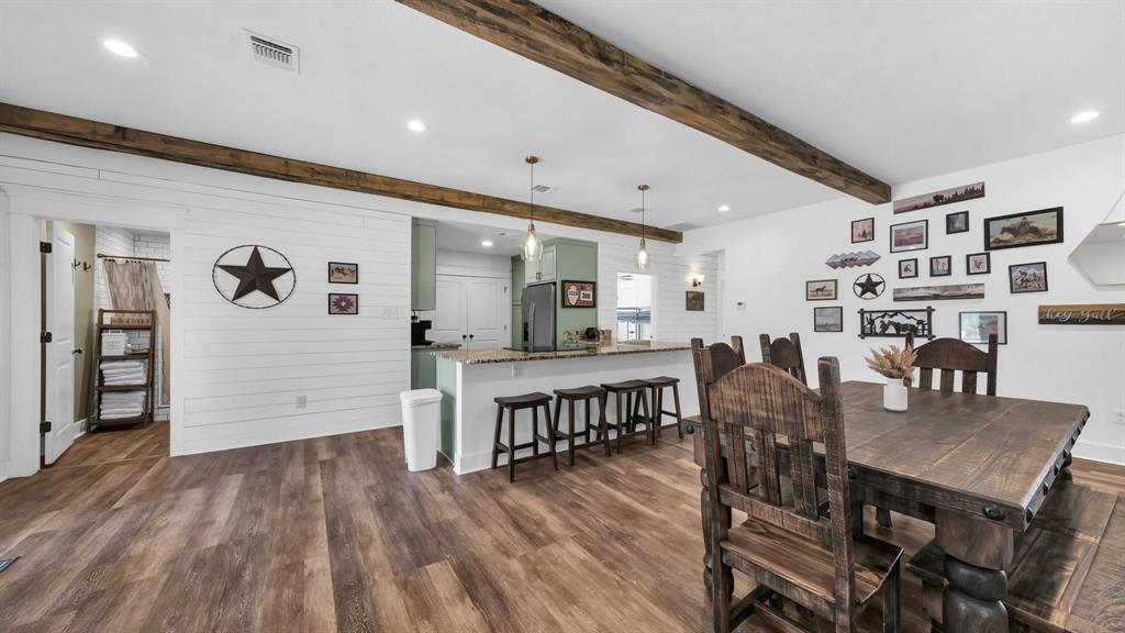 133 Prairie Lane Weatherford, TX 76087 - Photo 12 of 38 a view of a dining room with furniture and wooden floor