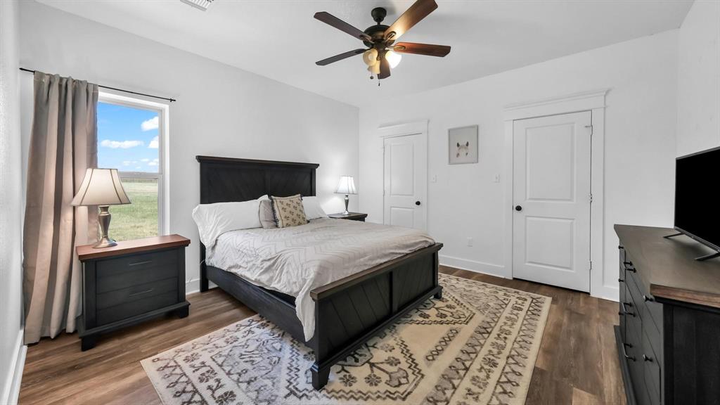 133 Prairie Lane Weatherford, TX 76087 - Photo 16 of 38 a bedroom with a bed and a television