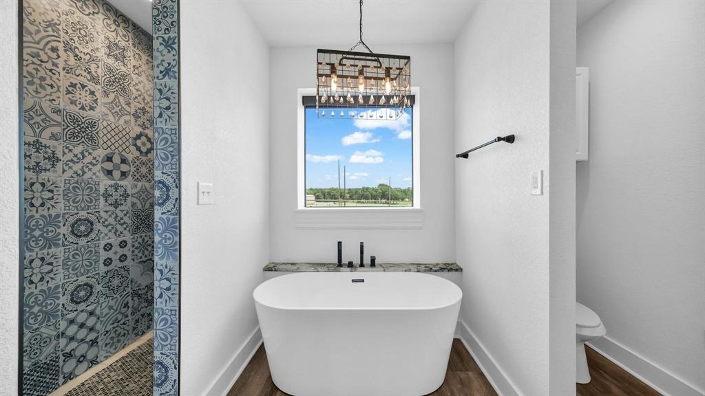 133 Prairie Lane Weatherford, TX 76087 - Photo 22 of 38 a bathroom with a sink and a mirror