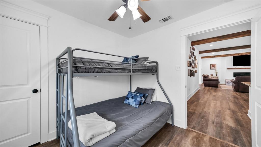 133 Prairie Lane Weatherford, TX 76087 - Photo 25 of 38 a living room with furniture and a wooden floor