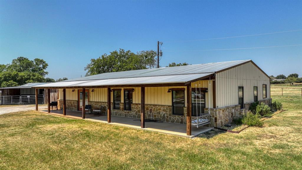 133 Prairie Lane Weatherford, TX 76087 - Photo 5 of 38 a view of a house with wooden floor and roof