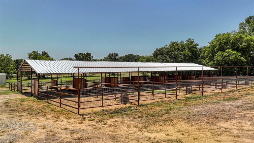 133 Prairie Lane Weatherford, TX 76087 - Photo 6 of 38 a view of a deck with a table and chairs a barbeque with wooden fence