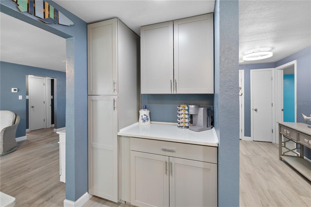 3336 Gulfview Drive Hernando Beach, FL 34607 - Photo 13 of 45 a kitchen with a sink cabinets and wooden floor