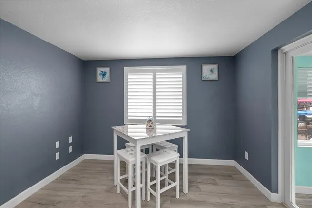 an empty room with closet and windows