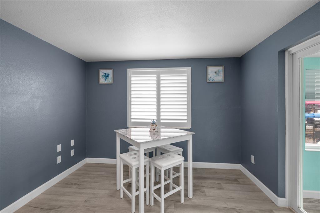 3336 Gulfview Drive Hernando Beach, FL 34607 - Photo 15 of 45 a dining room with furniture and window