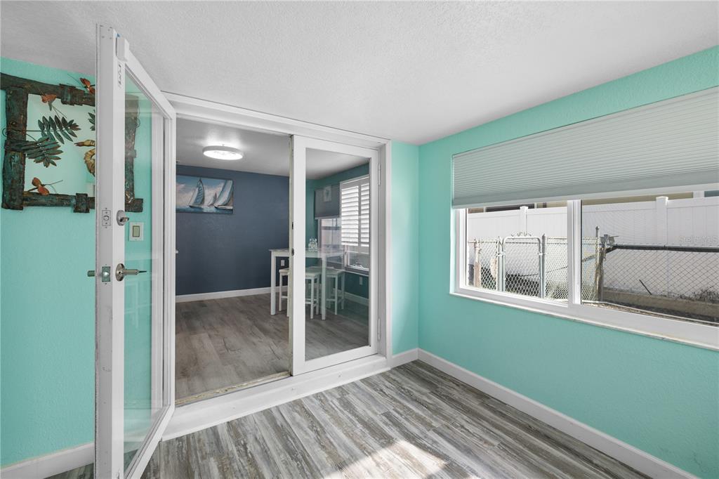 3336 Gulfview Drive Hernando Beach, FL 34607 - Photo 17 of 45 a view of empty room with window and wooden floor