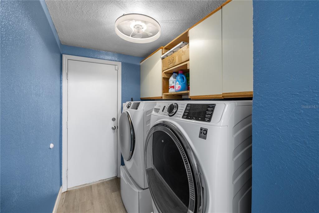 3336 Gulfview Drive Hernando Beach, FL 34607 - Photo 22 of 45 a utility room with dryer and washer