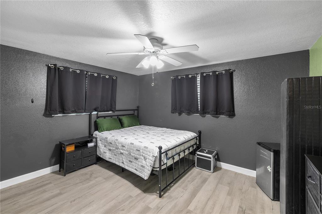 3336 Gulfview Drive Hernando Beach, FL 34607 - Photo 23 of 45 a bedroom with a bed and a chandelier