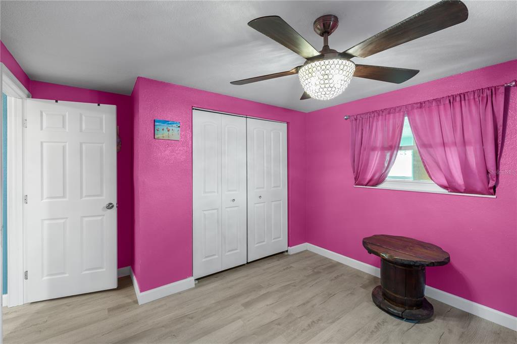 3336 Gulfview Drive Hernando Beach, FL 34607 - Photo 28 of 45 a view of a livingroom with furniture and chandelier fan
