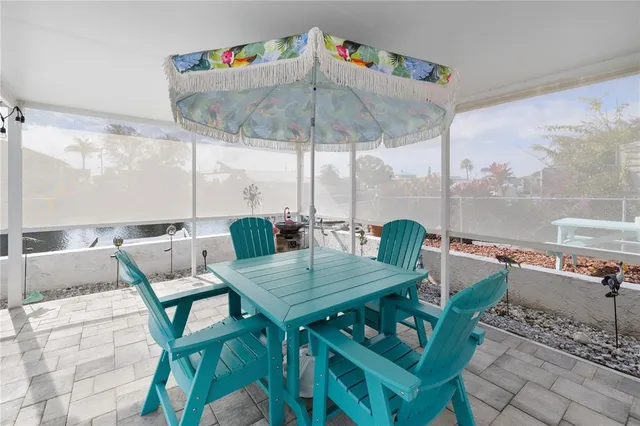 a balcony with furniture and a potted plant