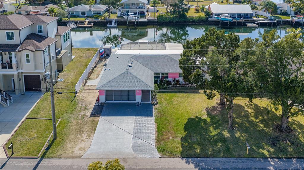 3336 Gulfview Drive Hernando Beach, FL 34607 - Photo 40 of 45 an aerial view of a house with swimming pool and lake view