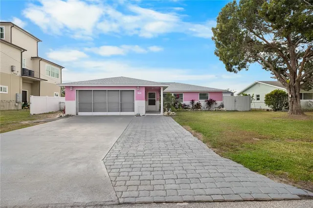 a view of house with yard