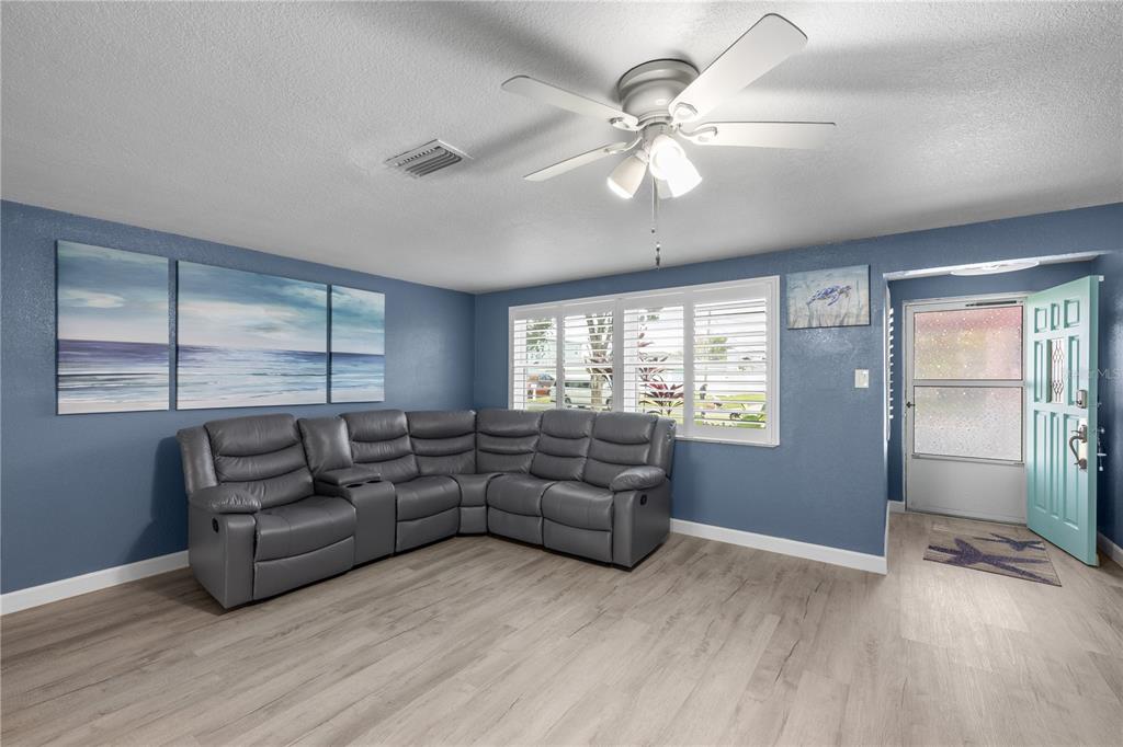 3336 Gulfview Drive Hernando Beach, FL 34607 - Photo 6 of 45 a living room with furniture and a window