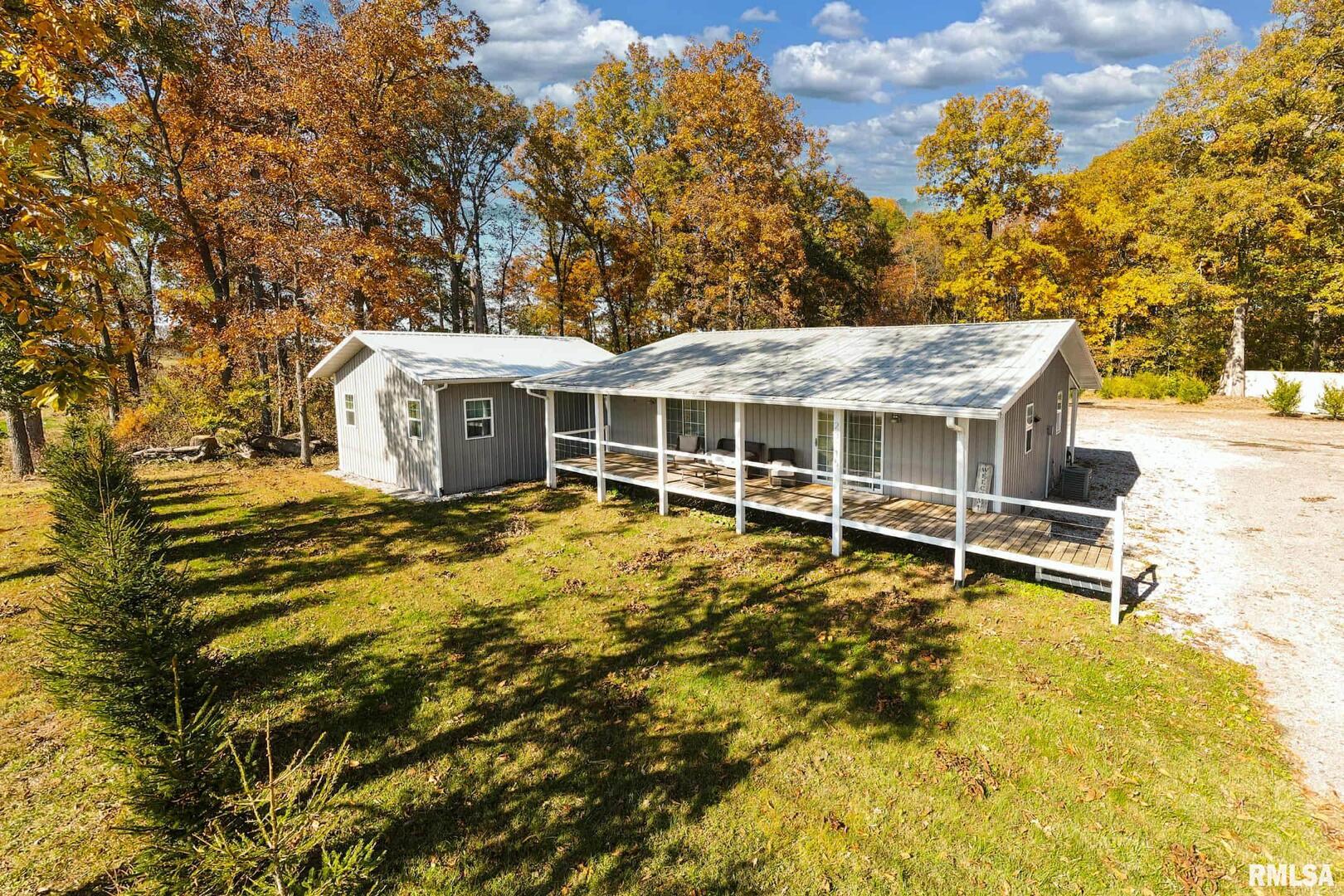 a view of a house with a backyard
