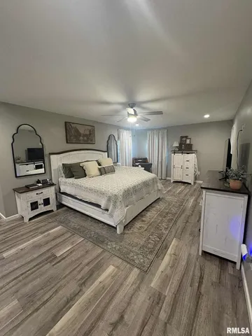 a bedroom with a bed and a view of bedroom