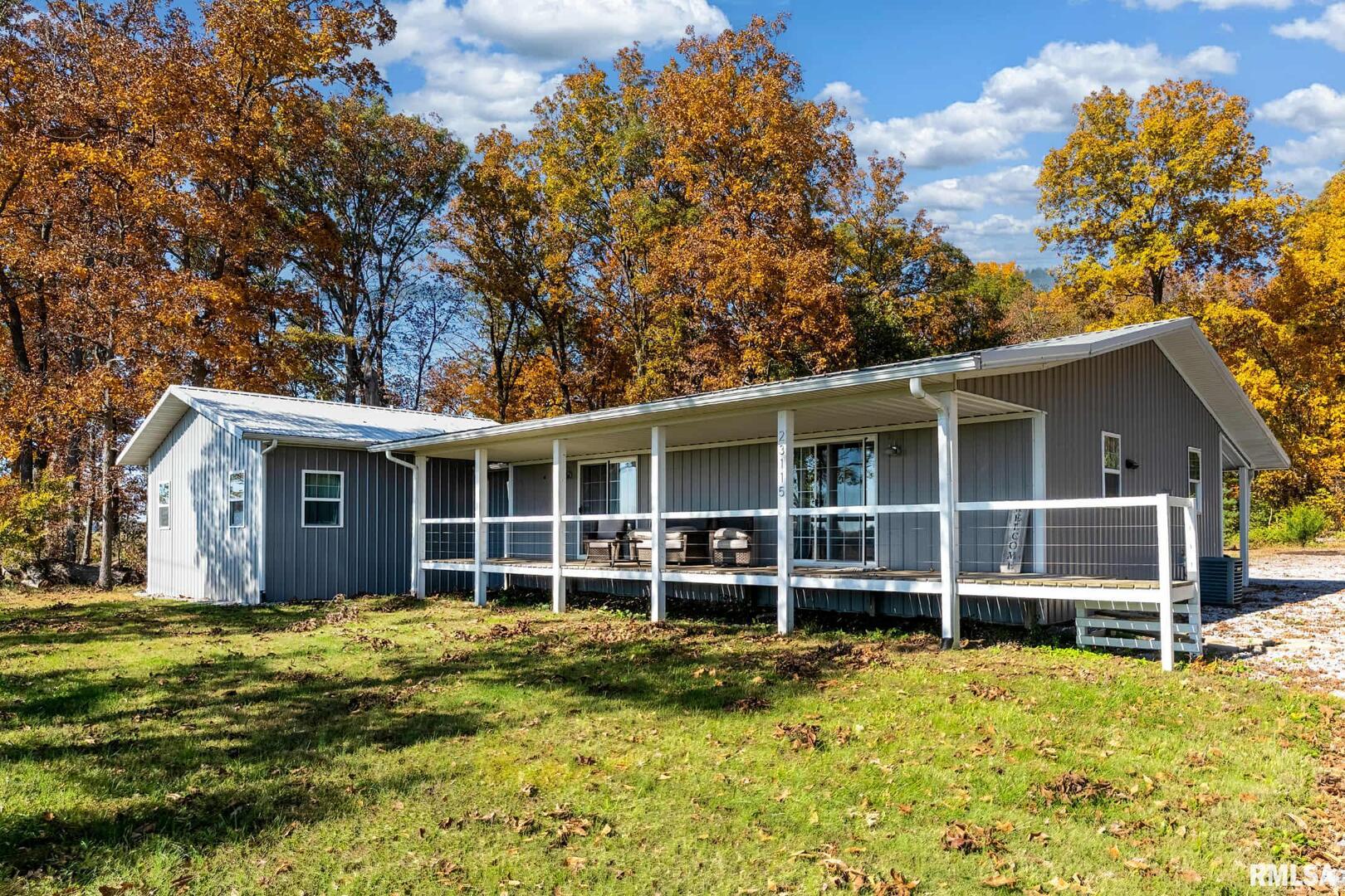 23115 Highway 14 Macedonia, IL 62860 - Photo 30 of 34 a view of a house with a yard