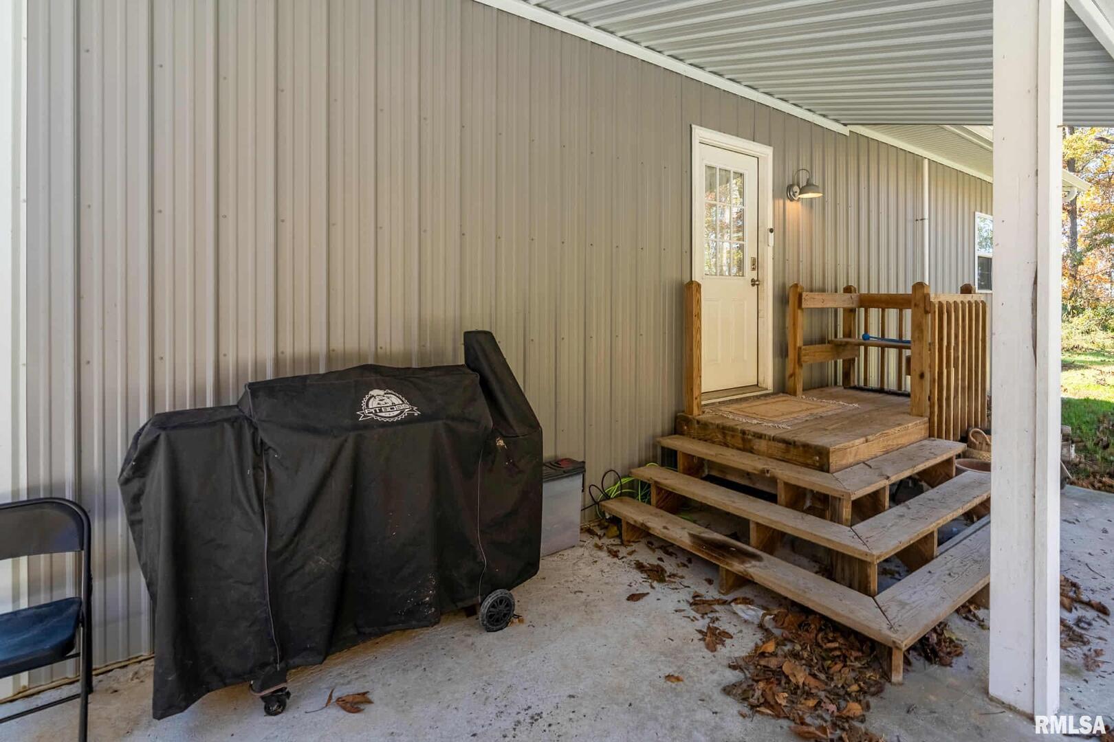 23115 Highway 14 Macedonia, IL 62860 - Photo 32 of 34 a bedroom with a bed and wooden cabinets