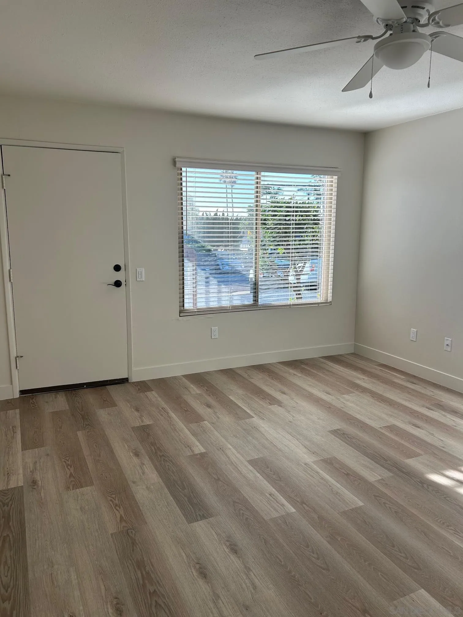 225 Melrose Avenue, Unit 2 Encinitas, CA 92024 - Photo 4 of 18 a view of an empty room with a window