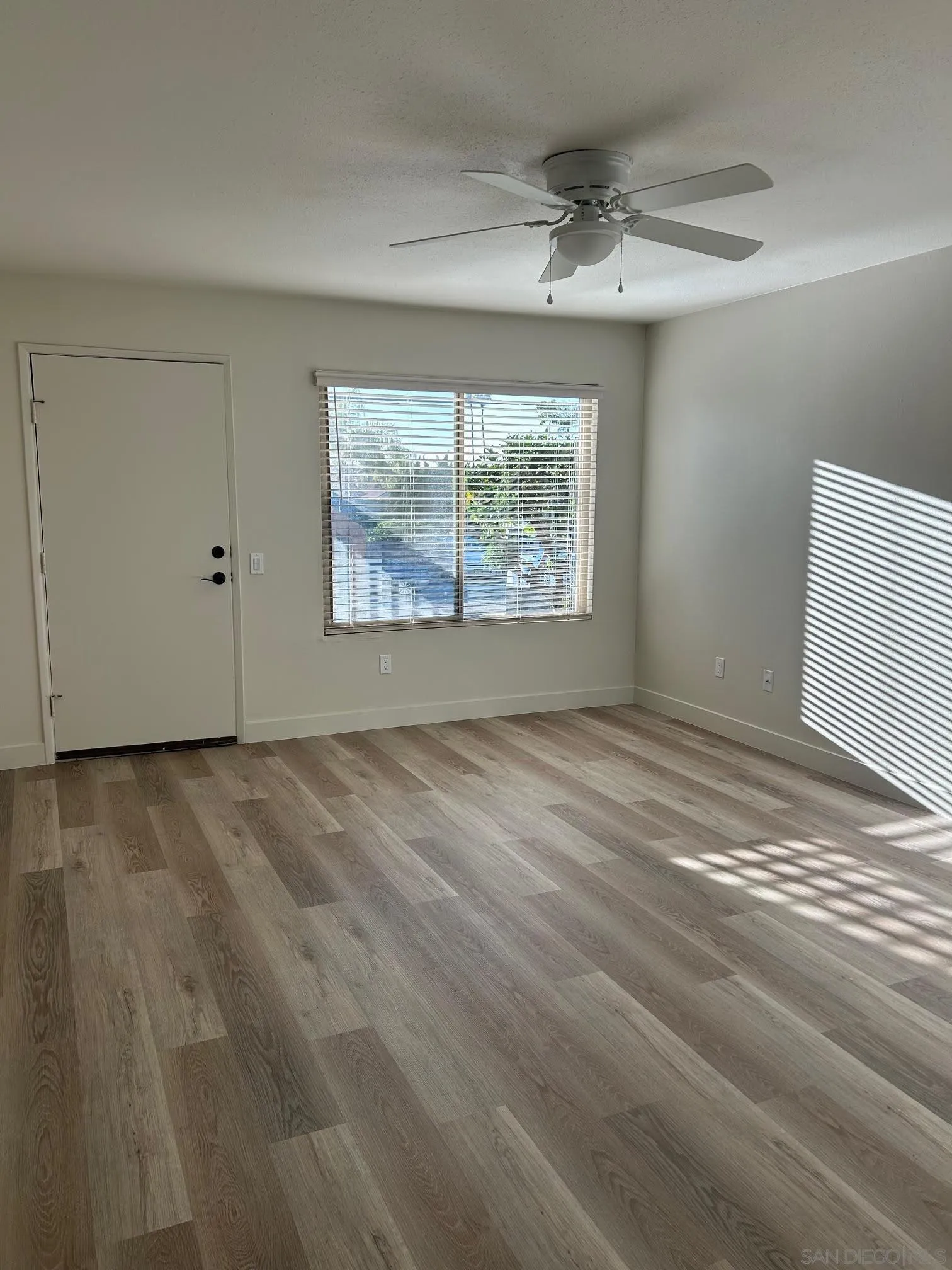 225 Melrose Avenue, Unit 2 Encinitas, CA 92024 - Photo 6 of 18 a view of an empty room with a window
