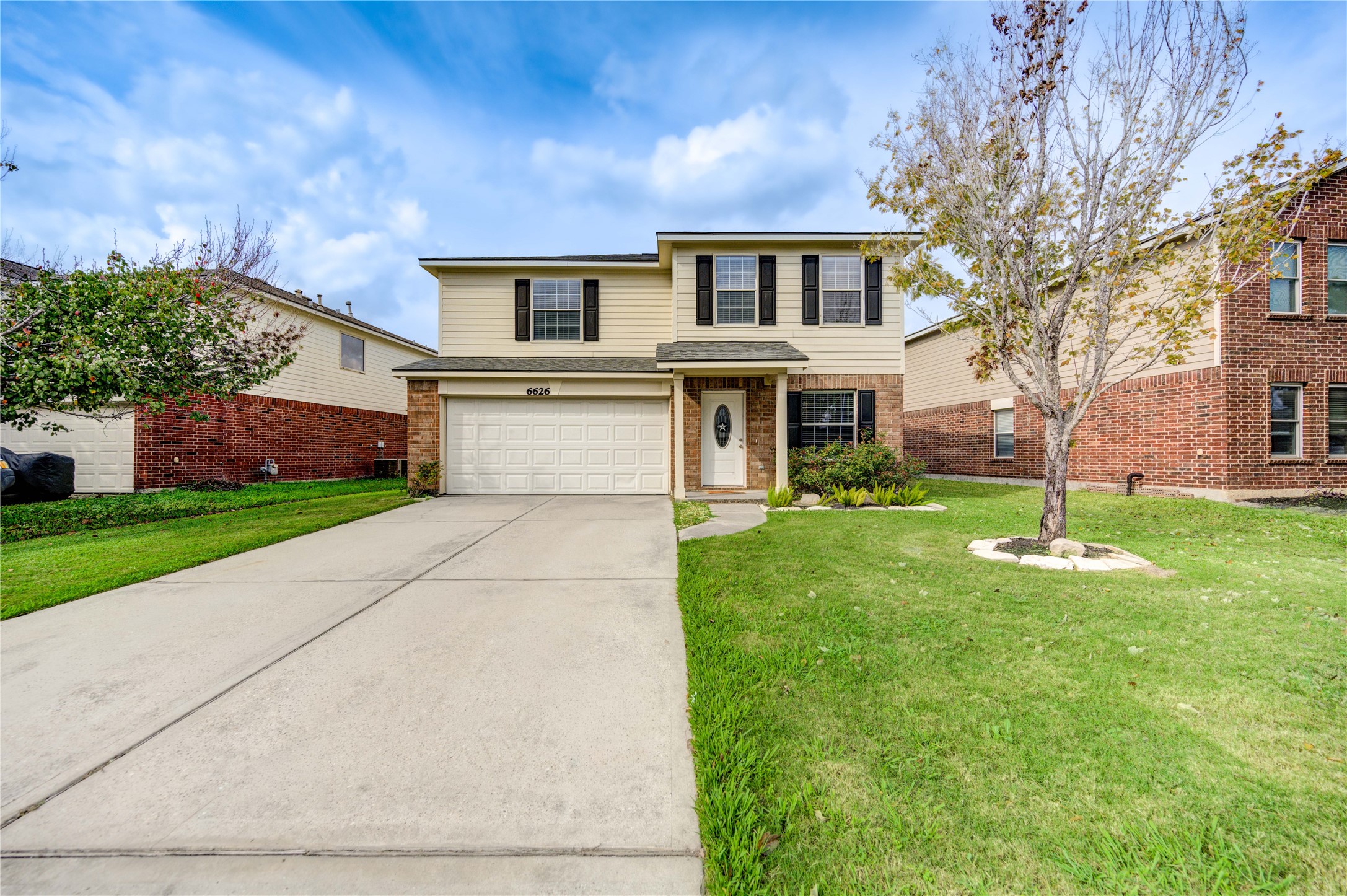 front view of a house with a yard