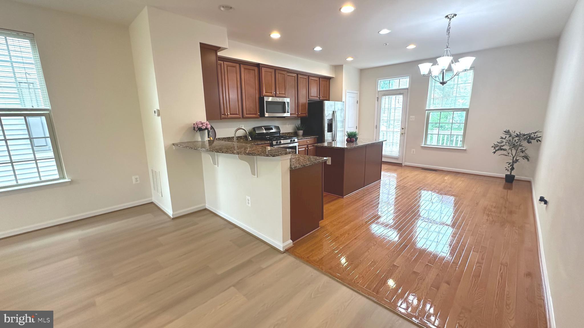 7343 Old Calvary Road Hanover, MD 21076 - Photo 13 of 35 a kitchen with a refrigerator and a stove