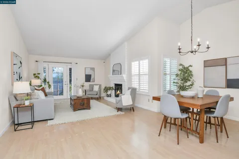 a view of a livingroom with furniture window and wooden floor