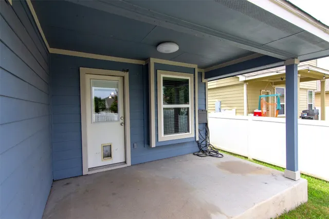 a kitchen with kitchen island granite countertop a sink counter top space appliances and cabinets