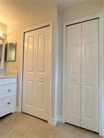 a bathroom with a shower and a mirror