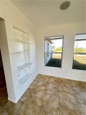 a view of an empty room and window