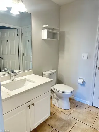 a bathroom with a sink toilet and vanity