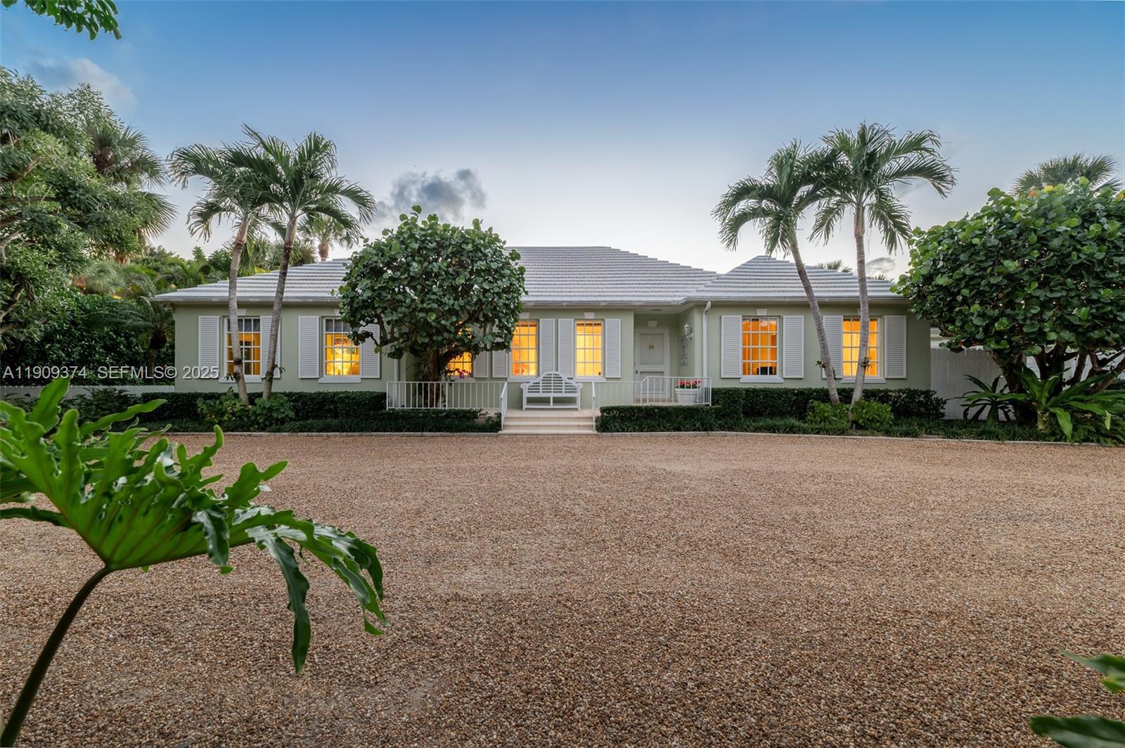 a front view of a house with a yard and a porch