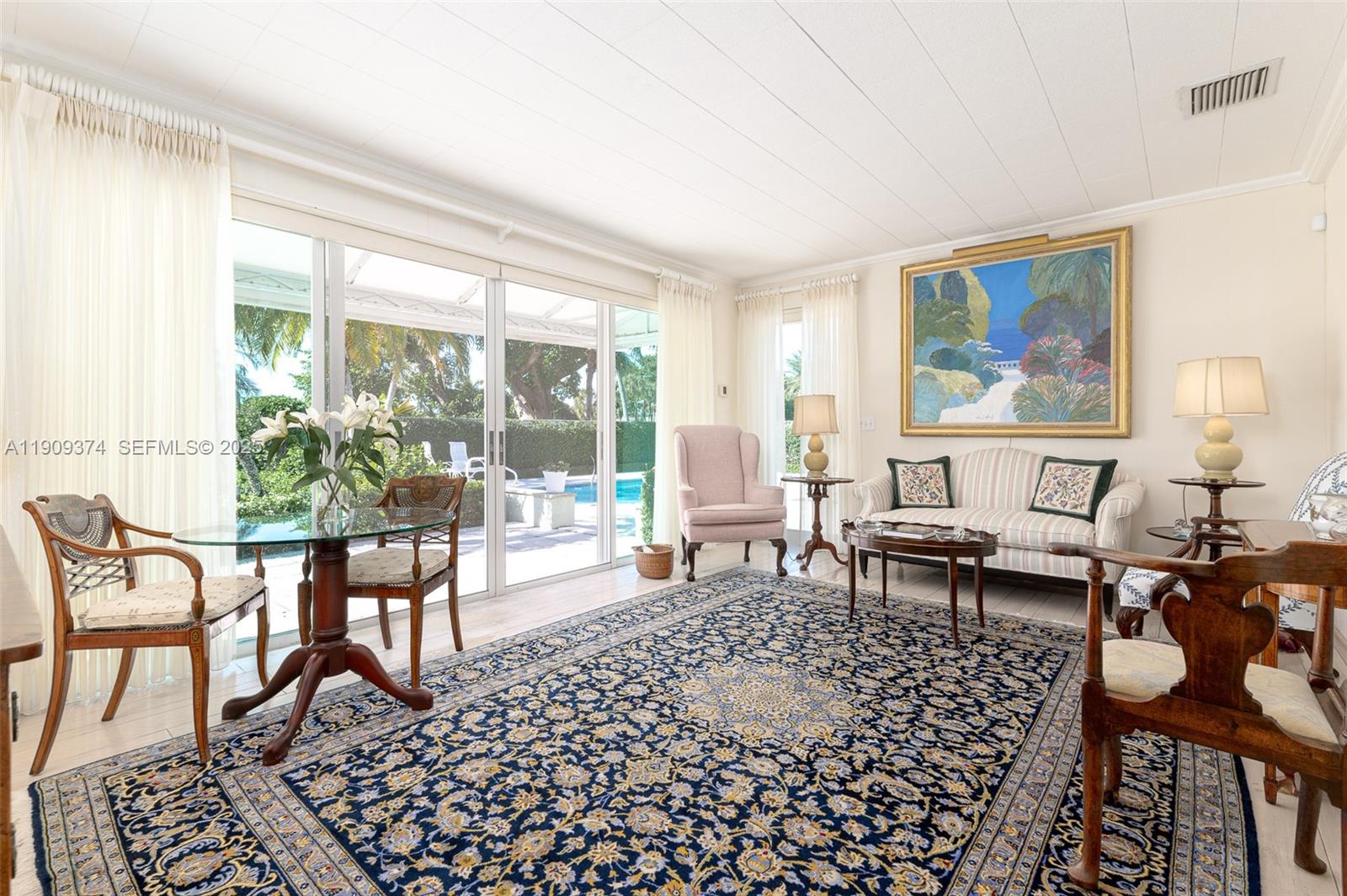 18 Gomez Road Jupiter Island, FL 33455 - Photo 14 of 34 a living room with furniture a rug and a large window
