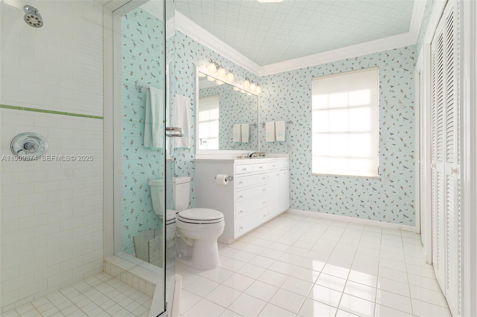 18 Gomez Road Jupiter Island, FL 33455 - Photo 17 of 34 a bathroom with a toilet a sink and shower