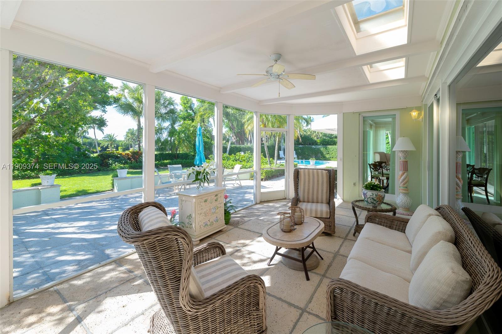 18 Gomez Road Jupiter Island, FL 33455 - Photo 20 of 34 a living room with patio furniture and a large window