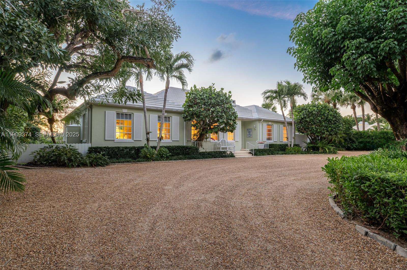 18 Gomez Road Jupiter Island, FL 33455 - Photo 2 of 34 a front view of house with yard and green space