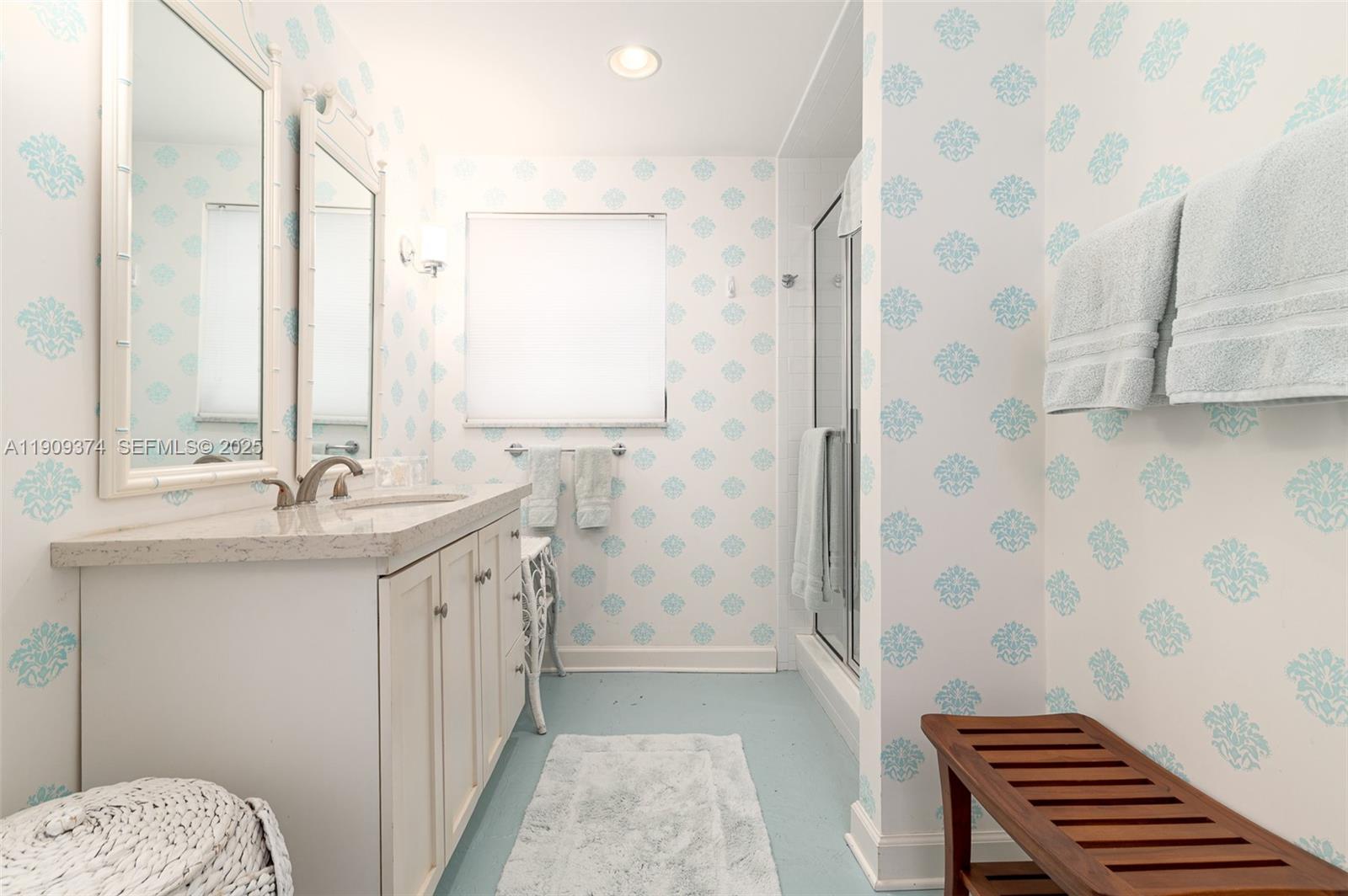 18 Gomez Road Jupiter Island, FL 33455 - Photo 25 of 34 a bathroom with a sink a toilet a shower and a mirror